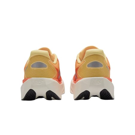 Ténis New Balance FuelCell Rebel v5 Laranja Amarelo SS26 Feminino